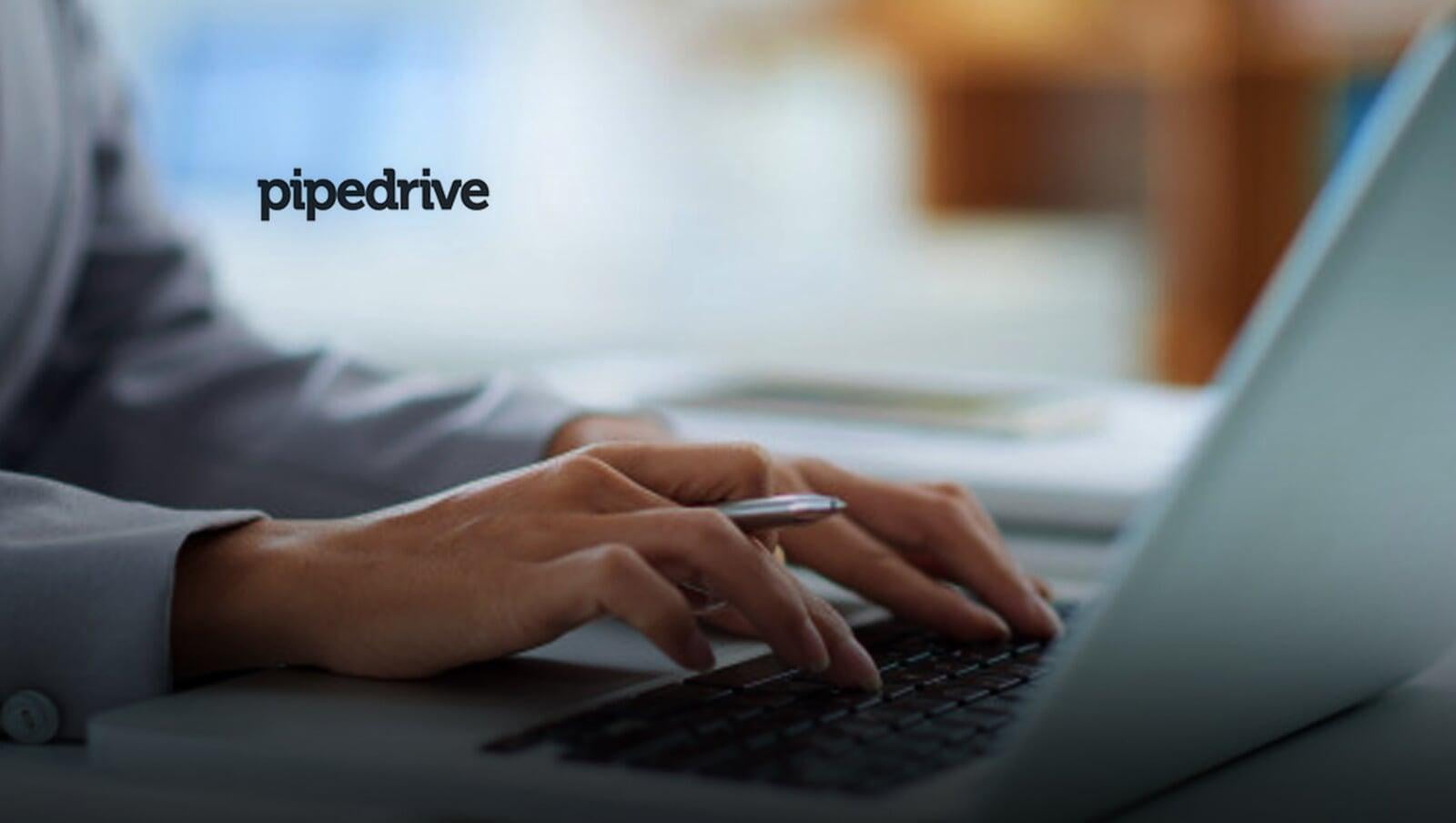 Hands typing on a laptop with Pipedrive on the screen